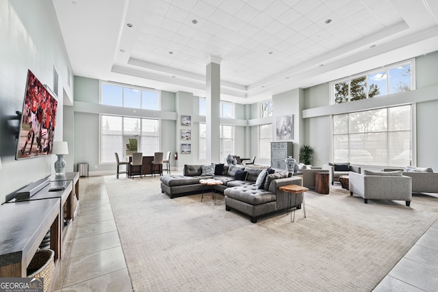 3820 Roswell Rd NE Unit 705, Atlanta, GA 30342 - living room featuring a high ceiling, a raised ceiling, and light tile patterned flooring