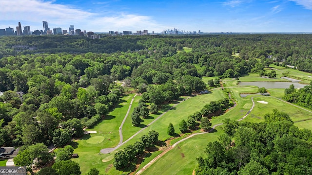 3820 Roswell Rd NE Unit 705, Atlanta, GA 30342 - aerial view of property and surrounding area featuring a nearby body of water, city skyline, a local golf course, and a forest