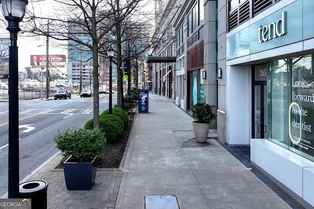 3820 Roswell Rd NE Unit 705, Atlanta, GA 30342 - view of asphalt road with sidewalks, street lights, and curbs