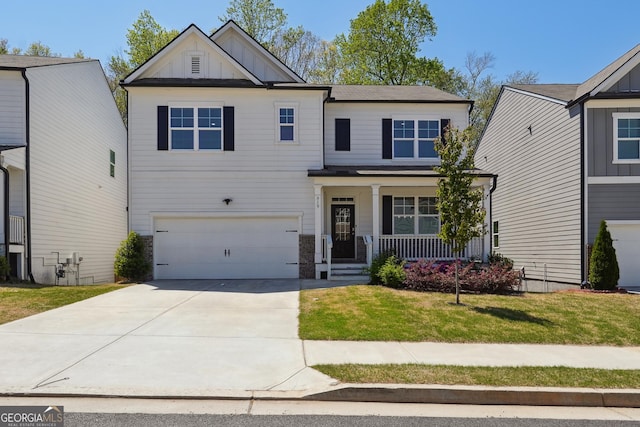 craftsman-style home featuring a garage, board and batten siding, a porch, a front yard, and driveway