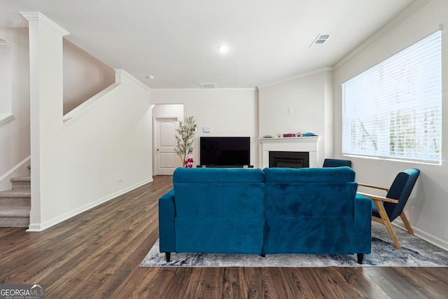 living area with stairway, baseboards, dark wood finished floors, and visible vents