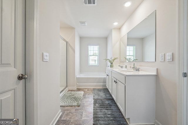 full bathroom featuring a sink, a shower stall, a garden tub, and visible vents