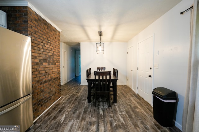 253 Dry Creek Rd, Cedartown, GA 30125 - dining area featuring baseboards, dark wood-style flooring, and brick wall