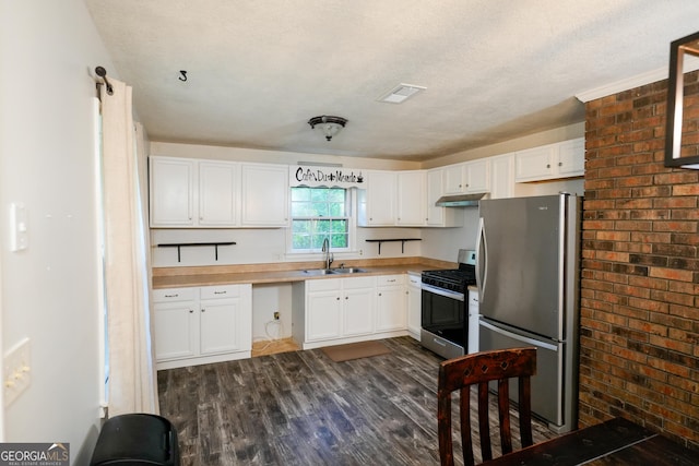 253 Dry Creek Rd, Cedartown, GA 30125 - kitchen with appliances with stainless steel finishes, a sink, white cabinetry, visible vents, and dark wood-style floors