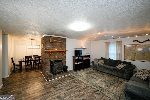 253 Dry Creek Rd, Cedartown, GA 30125 - living area featuring baseboards, a textured ceiling, wood finished floors, and a wood stove