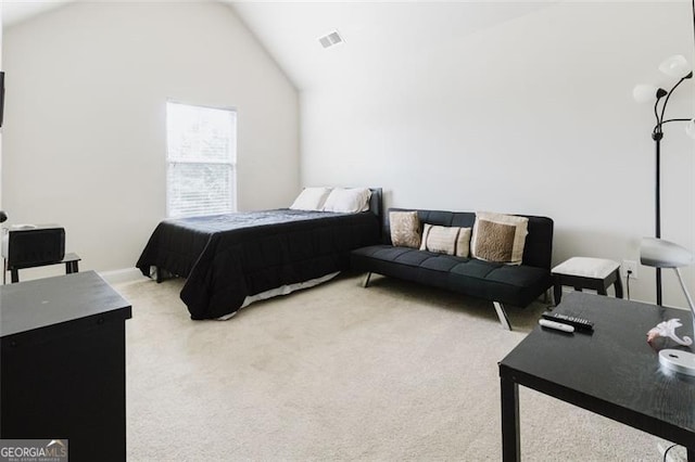 carpeted bedroom featuring visible vents and lofted ceiling