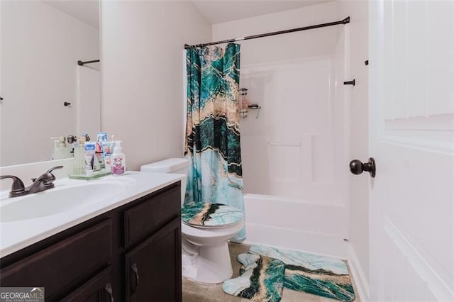 bathroom featuring vanity, toilet, and shower / tub combo