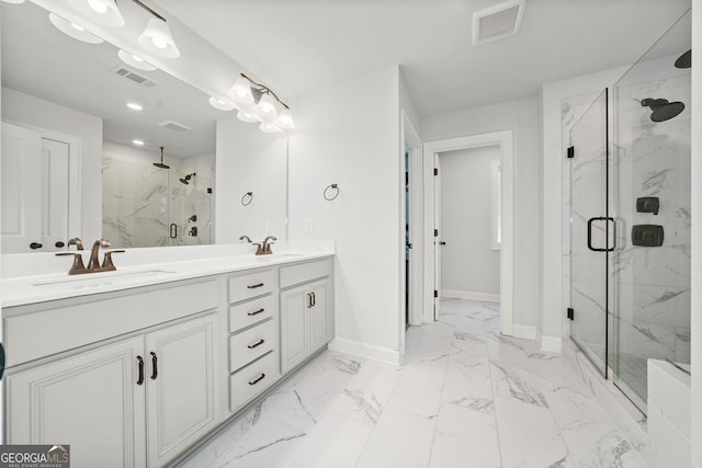 full bath with visible vents, marble finish floor, baseboards, a sink, and a marble finish shower