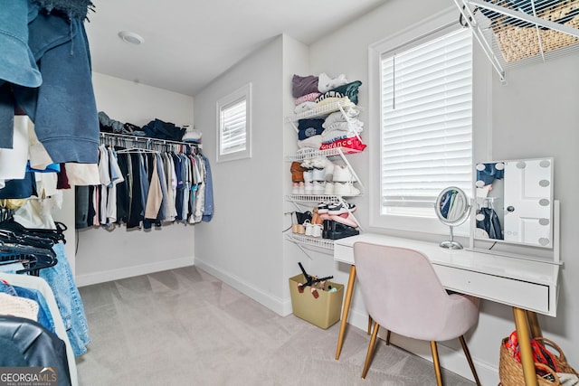 walk in closet featuring carpet flooring