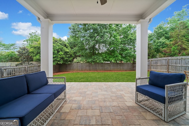 view of patio featuring an outdoor hangout area and a fenced backyard