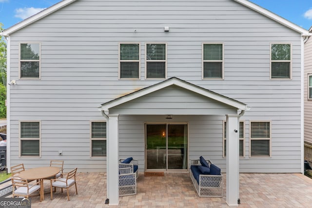 back of house with a patio