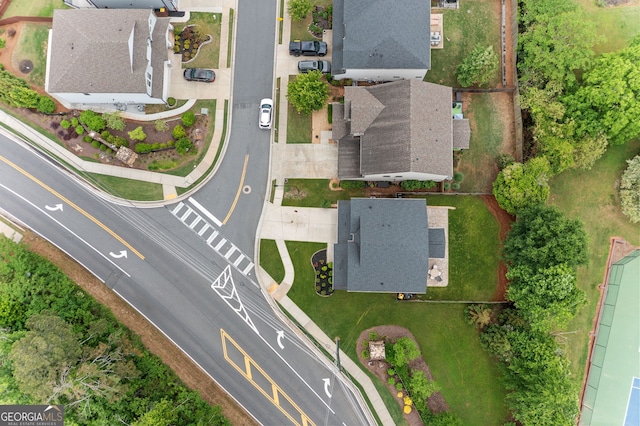 birds eye view of property with a residential view