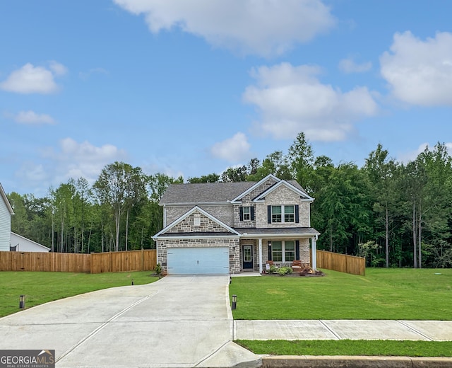 view of front of home with a porch, driveway, a front yard, fence, and stone siding