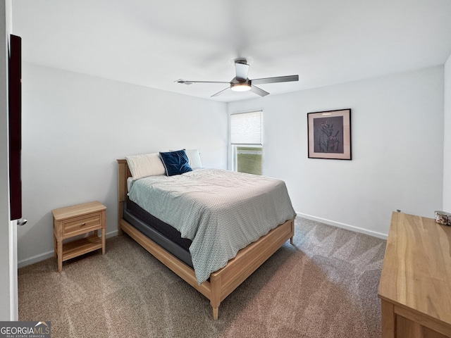 bedroom with baseboards, ceiling fan, carpet flooring, and visible vents