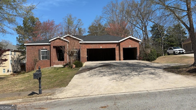 8828 Patricia Rose, Douglasville, GA 30134 - view of front of house with an attached garage, a front lawn, brick siding, and driveway