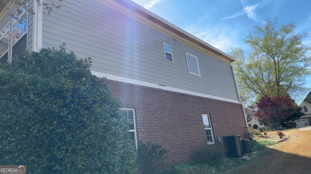 8828 Patricia Rose, Douglasville, GA 30134 - view of home's exterior featuring central air condition unit and brick siding