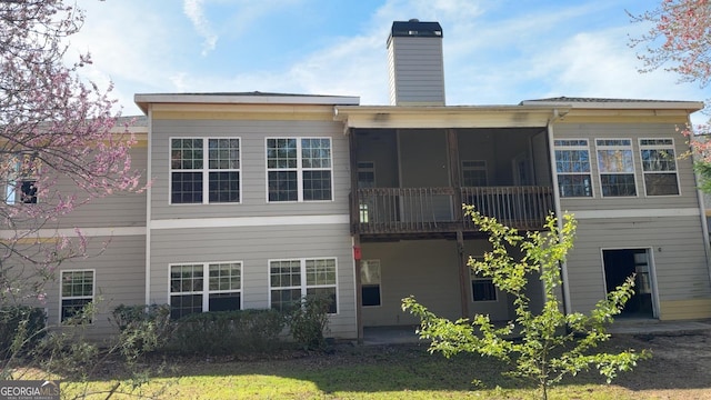 8828 Patricia Rose, Douglasville, GA 30134 - back of house featuring a chimney