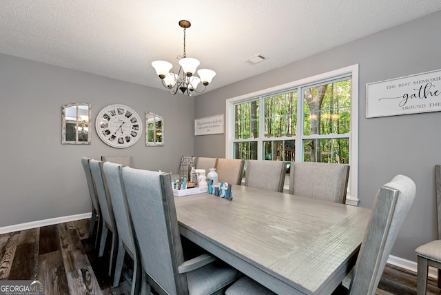 150 Buckeye Trails Dr, Commerce, GA 30530 - dining area featuring visible vents, dark wood finished floors, baseboards, and a notable chandelier