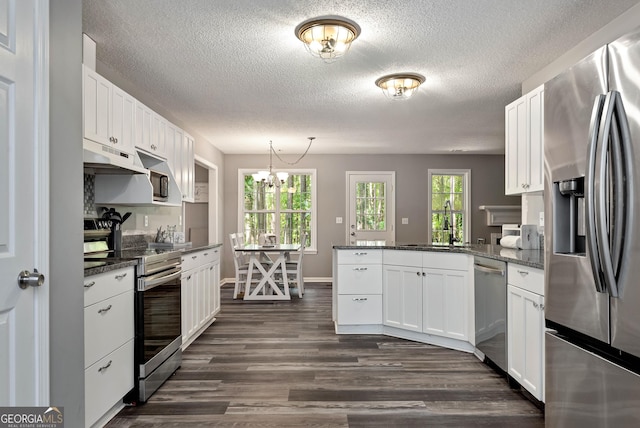 150 Buckeye Trails Dr, Commerce, GA 30530 - kitchen featuring appliances with stainless steel finishes, under cabinet range hood, a peninsula, and white cabinetry