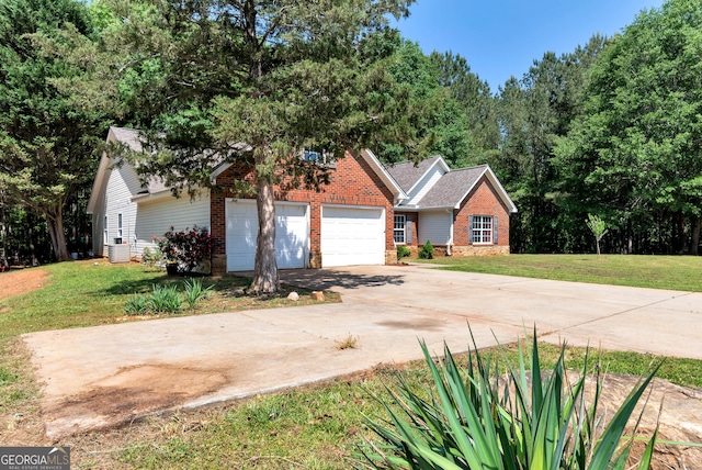 150 Buckeye Trails Dr, Commerce, GA 30530 - view of front of property with central air condition unit, concrete driveway, a front lawn, and brick siding