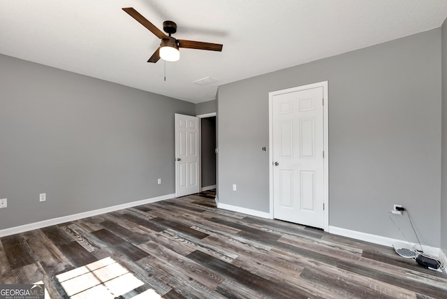 150 Buckeye Trails Dr, Commerce, GA 30530 - unfurnished bedroom with baseboards, ceiling fan, and dark wood finished floors