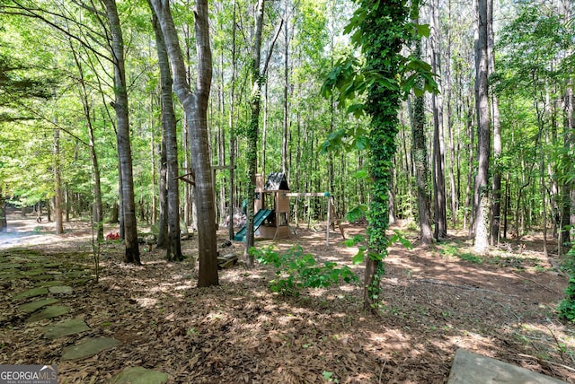 150 Buckeye Trails Dr, Commerce, GA 30530 - view of yard with a wooded view and a playground
