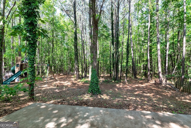 150 Buckeye Trails Dr, Commerce, GA 30530 - view of yard featuring a playground and a forest view