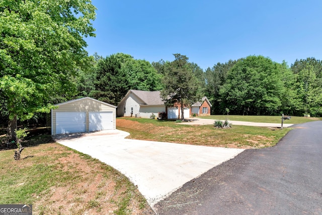 150 Buckeye Trails Dr, Commerce, GA 30530 - ranch-style home featuring a garage, a front lawn, and an outbuilding