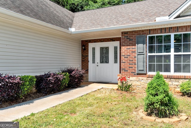 150 Buckeye Trails Dr, Commerce, GA 30530 - view of exterior entry with brick siding and roof with shingles