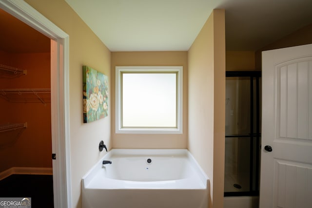 108 Hope Ln, Cedartown, GA 30125 - bathroom with an enclosed shower, a bath, and a walk in closet
