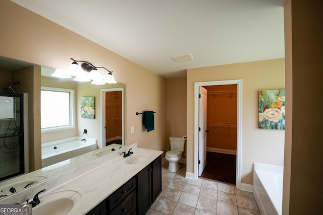 108 Hope Ln, Cedartown, GA 30125 - bathroom featuring toilet, baseboards, a sink, a garden tub, and double vanity