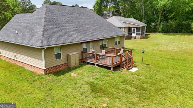 108 Hope Ln, Cedartown, GA 30125 - back of property featuring a lawn, a wooden deck, a sunroom, and a shingled roof