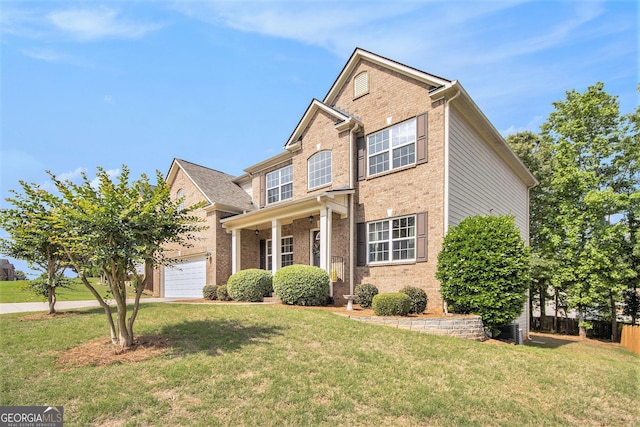 view of front of home with a front lawn, fence, brick siding, central AC unit, and an attached garage
