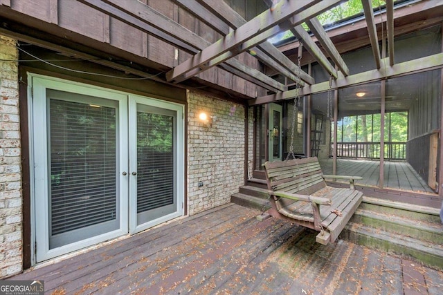 wooden deck featuring french doors