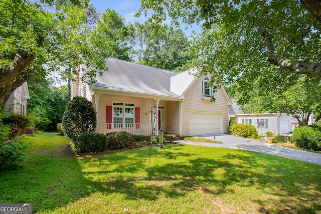 4481 Mccart Cv, Stone Mountain, GA 30083 - traditional-style home with driveway, an attached garage, covered porch, a chimney, and a front yard