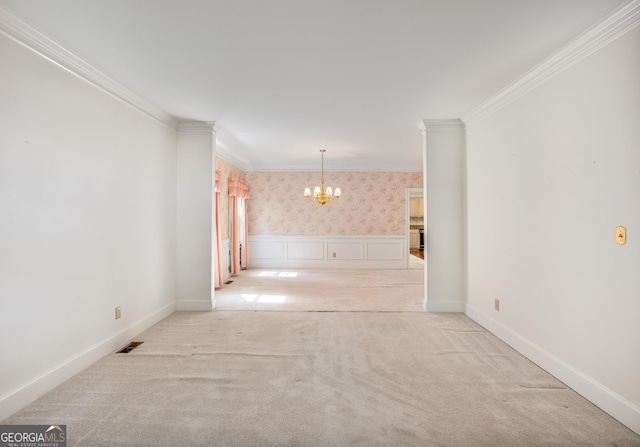 4481 Mccart Cv, Stone Mountain, GA 30083 - empty room with a chandelier, light colored carpet, crown molding, wallpapered walls, and a wainscoted wall