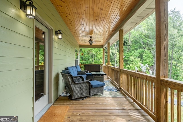 wooden deck with a ceiling fan
