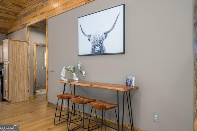 interior space featuring wood ceiling, baseboards, and wood finished floors