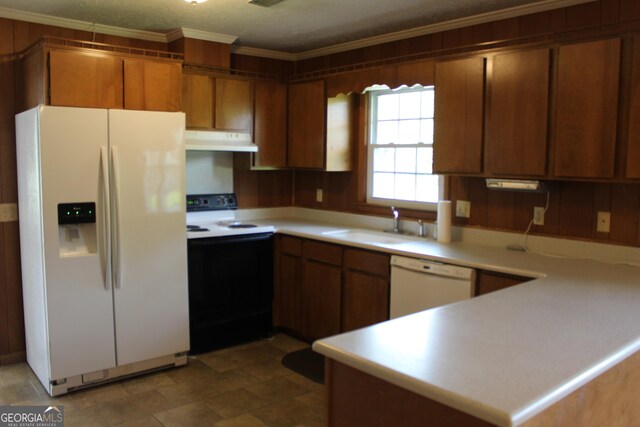 kitchen with white appliances, under cabinet range hood, ornamental molding, and light countertops