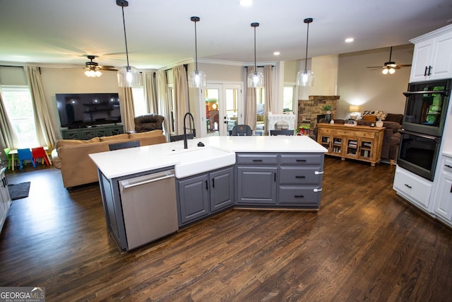 kitchen featuring open floor plan, gray cabinets, a ceiling fan, and dishwasher
