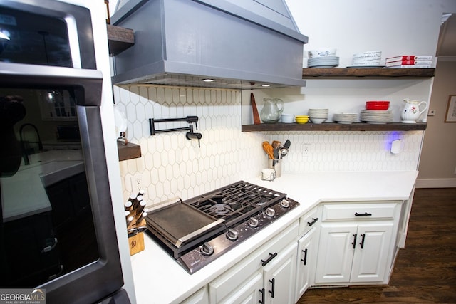 kitchen featuring open shelves, decorative backsplash, white cabinetry, and black gas stovetop