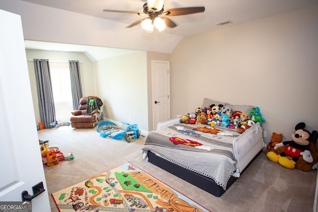 carpeted bedroom featuring visible vents, a ceiling fan, and vaulted ceiling