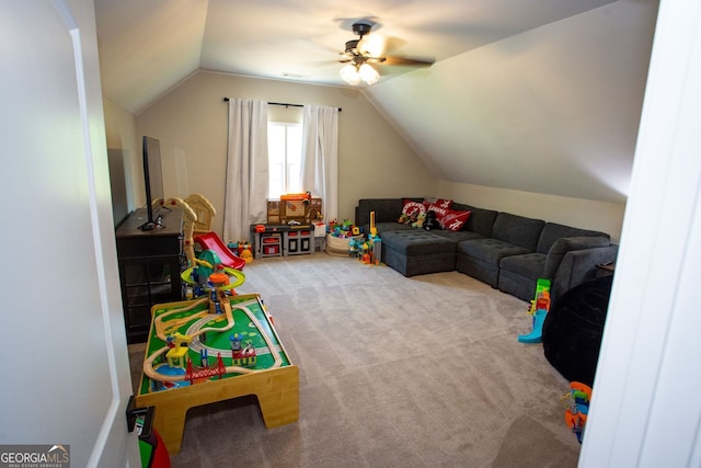 recreation room featuring carpet floors, a ceiling fan, and lofted ceiling