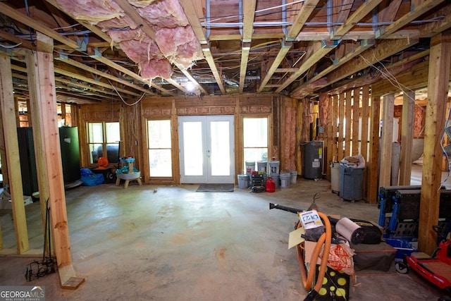 misc room with french doors and electric water heater