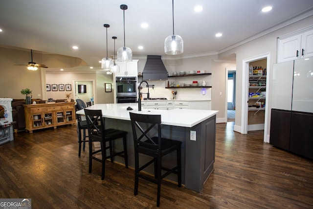kitchen with custom exhaust hood, recessed lighting, light countertops, a ceiling fan, and double wall oven