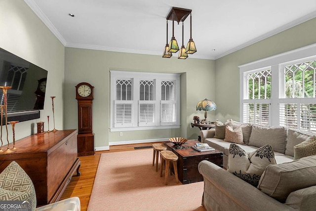 171 Westminster Dr NE, Atlanta, GA 30309 - living room featuring light wood-style floors, ornamental molding, and baseboards