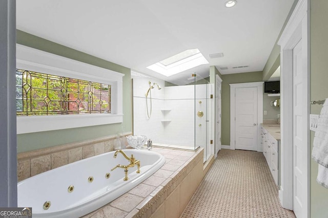 171 Westminster Dr NE, Atlanta, GA 30309 - bathroom with a skylight, a shower stall, a tub with jets, and vanity