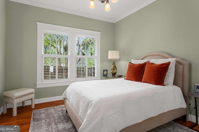 171 Westminster Dr NE, Atlanta, GA 30309 - bedroom featuring baseboards, a chandelier, crown molding, and wood finished floors