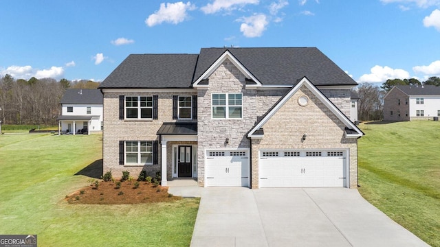 traditional home with concrete driveway, brick siding, a front yard, and a garage