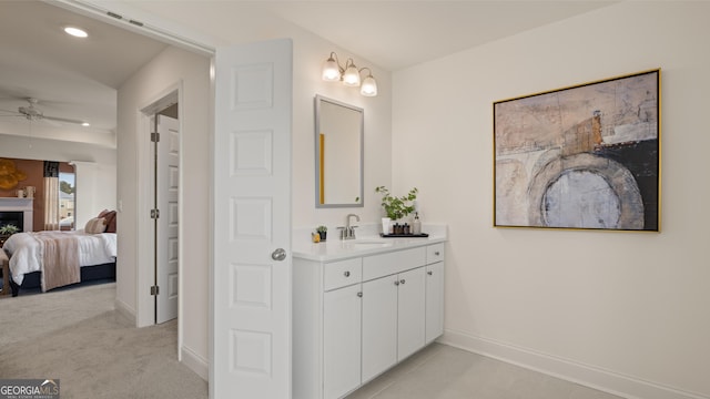 bathroom featuring connected bathroom, vanity, a ceiling fan, baseboards, and recessed lighting